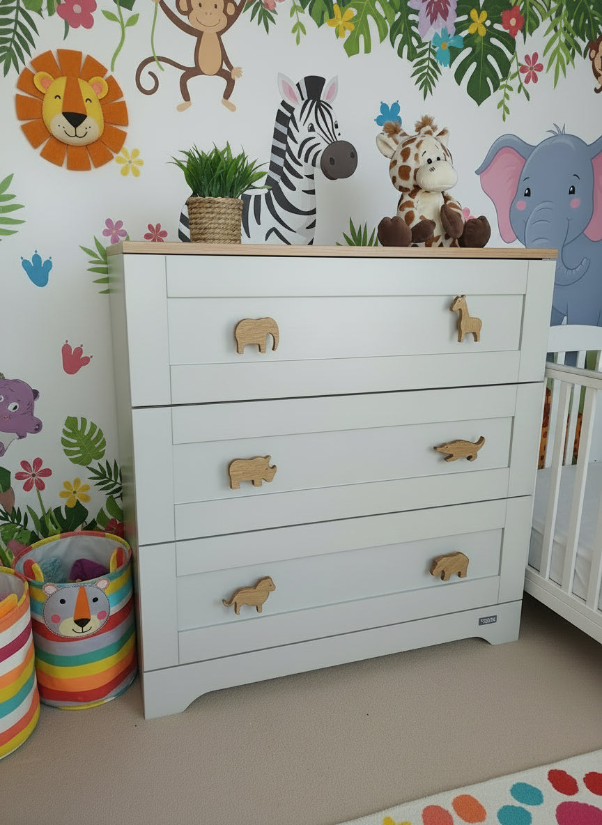 Safari animal drawer knobs on nursery dresser - jungle themed kids bedroom decor lifestyle