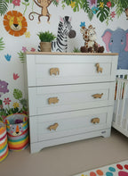Safari animal drawer knobs on nursery dresser - jungle themed kids bedroom decor lifestyle