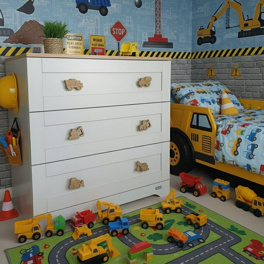 Construction vehicle drawer knobs installed on dresser in construction themed bedroom nursery decor