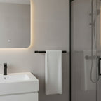 Black towel rail in bathroom setting - industrial decor towel holder installed