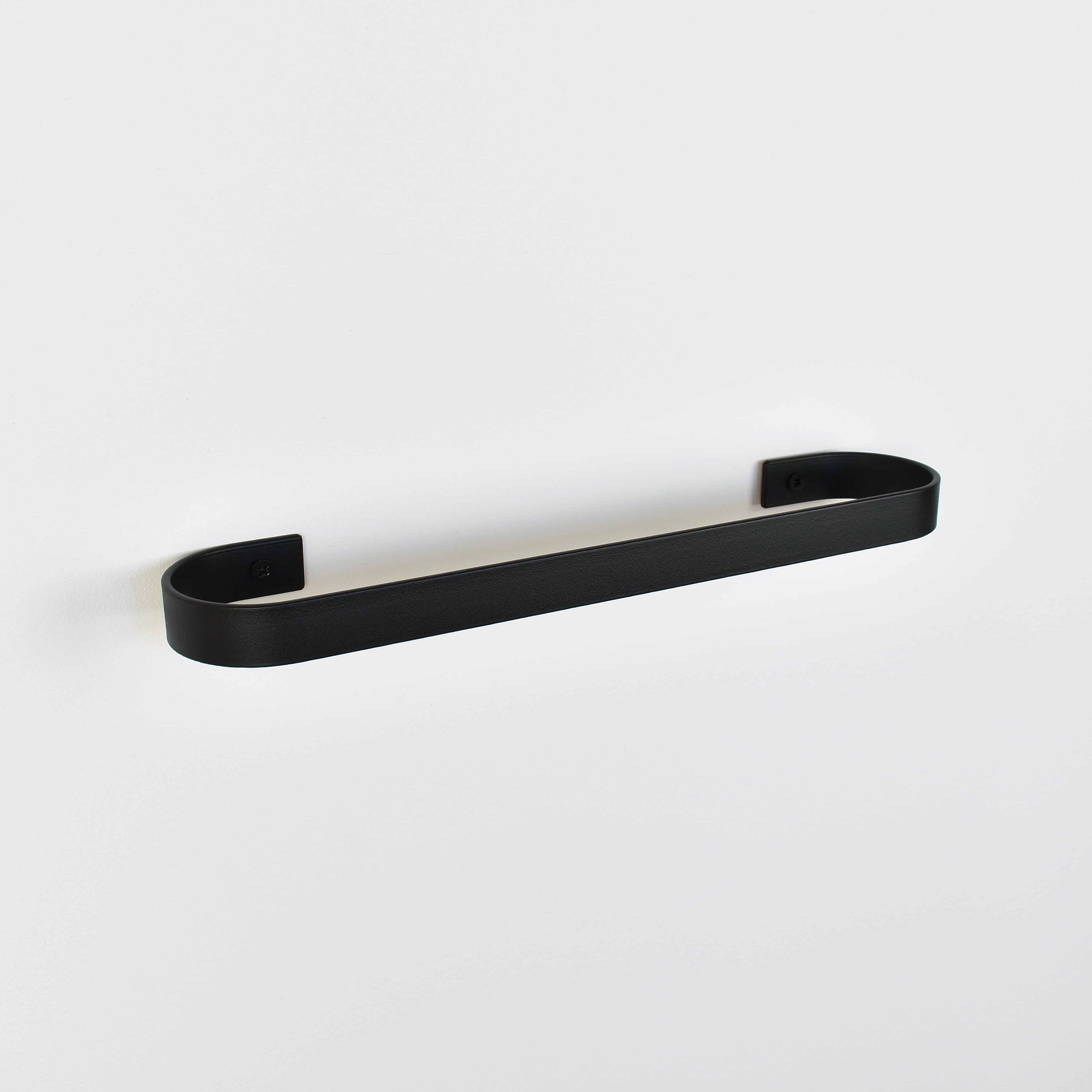 black metal towel rack on a white background - left view