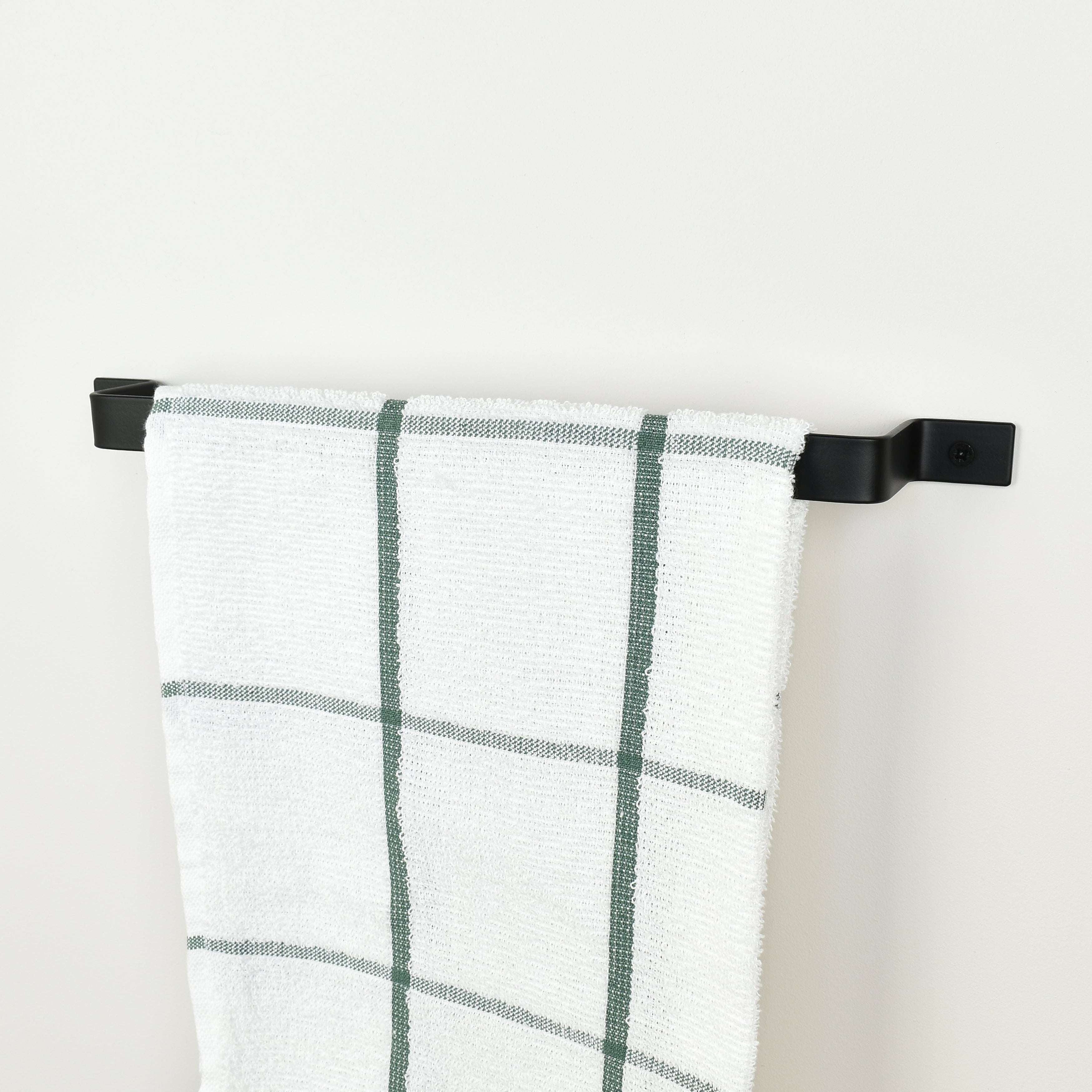 Black towel rail right side view with tea towel - industrial metal towel holder