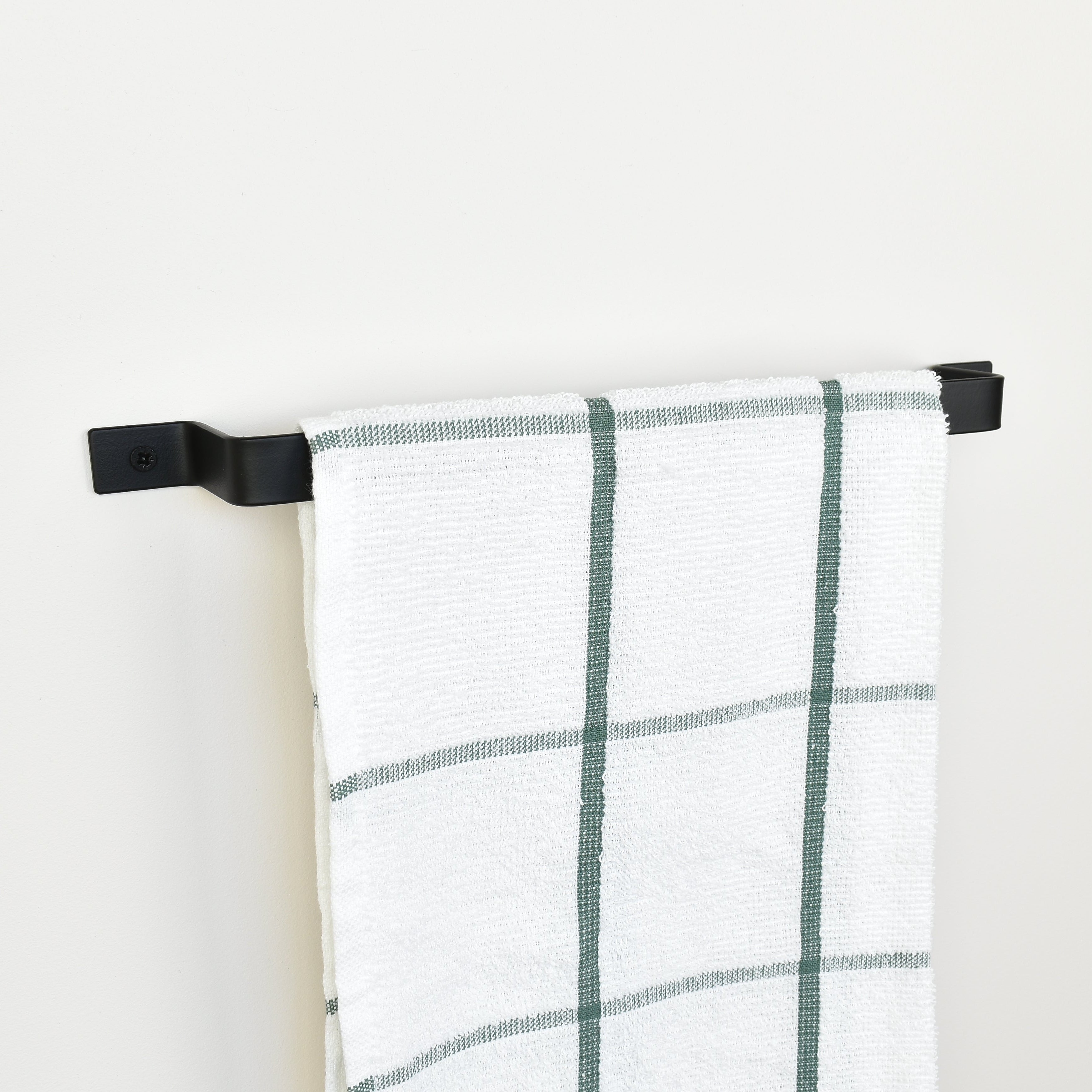 Black towel rail left side view with tea towel -modern metal towel holder