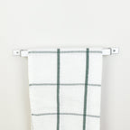 Close-up detail of silver steel towel bar finish and construction - premium quality bathroom fixture