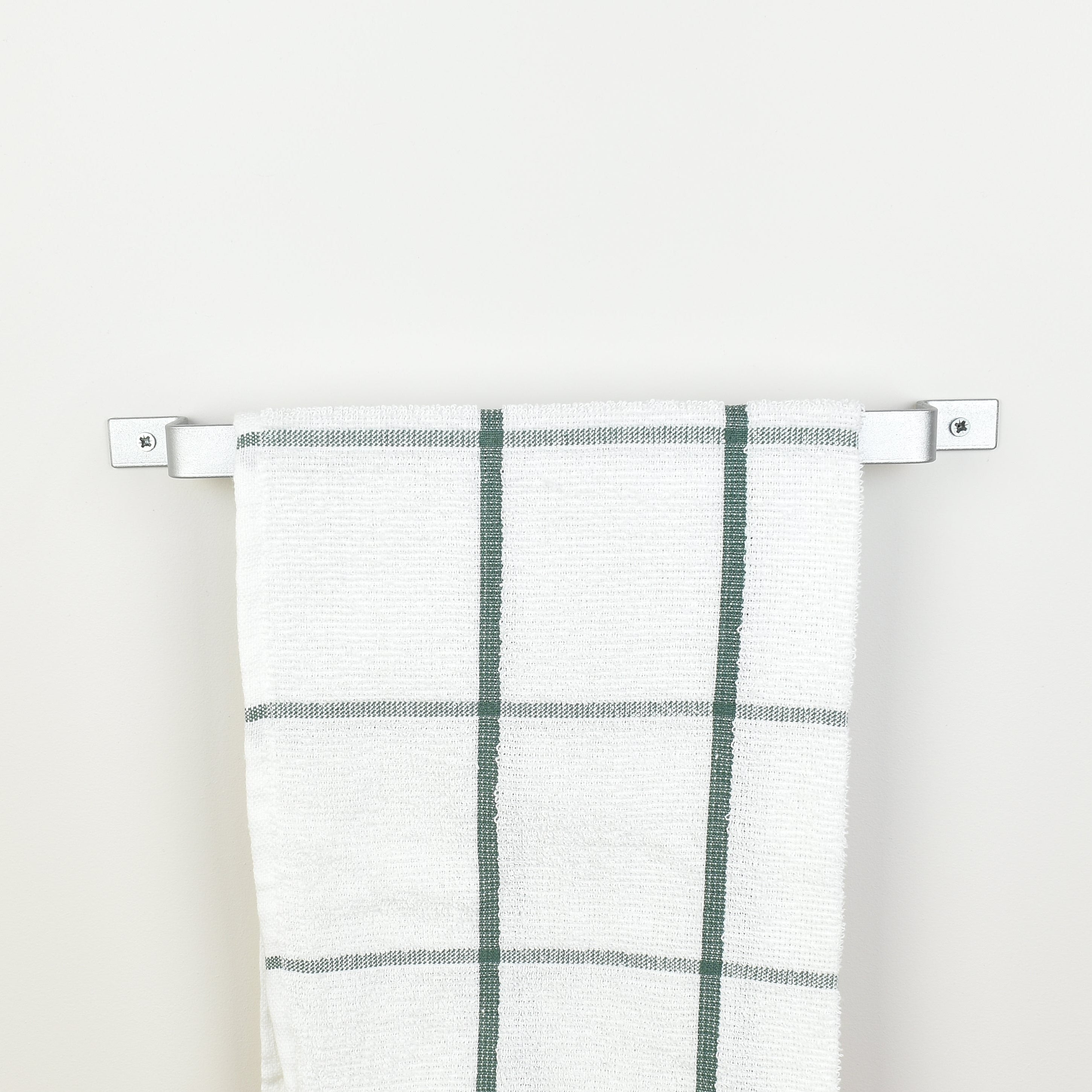 Close-up detail of silver steel towel bar finish and construction - premium quality bathroom fixture