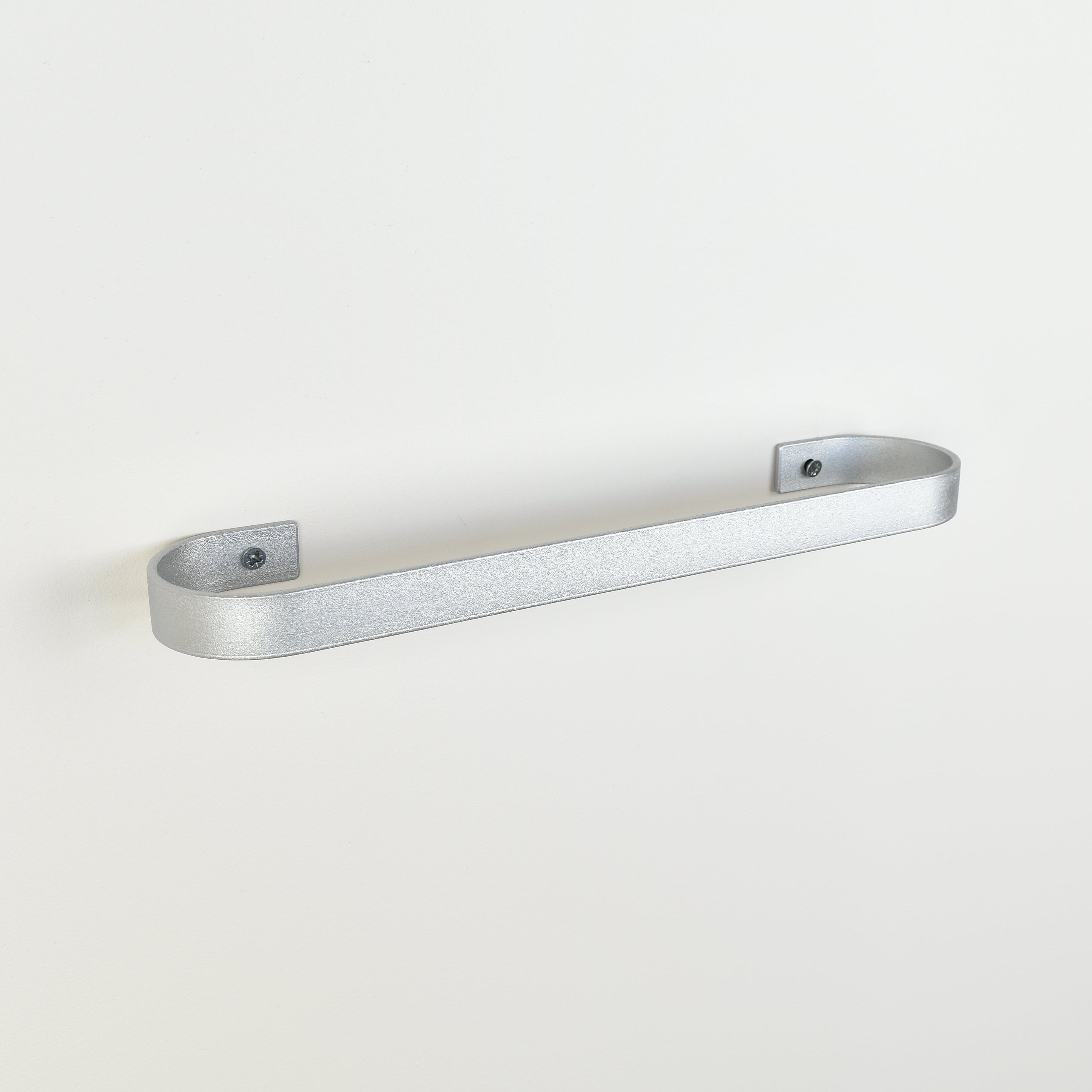 silver metal towel rack on a white background - left view