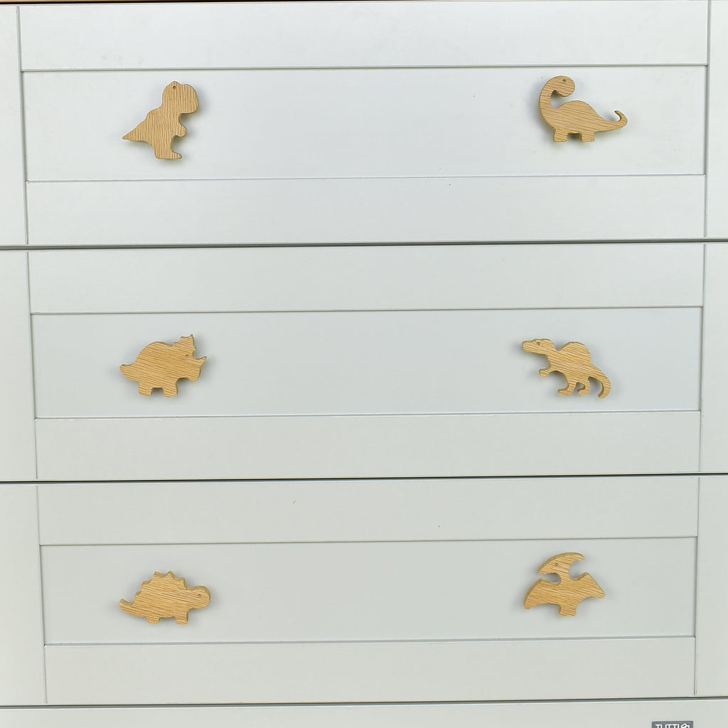 Dinosaur drawer knobs close-up front view - T-rex Brachiosaurus Triceratops Spinosaurus Stegosaurus Pterodactyl
