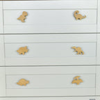 Dinosaur drawer knobs close-up front view - T-rex Brachiosaurus Triceratops Spinosaurus Stegosaurus Pterodactyl
