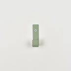 Colourful steel wall hook close-up front view - coat hook detail kids nursery
