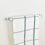 Silver industrial towel rail end bracket detail - handcrafted metal bathroom hardware made in UK