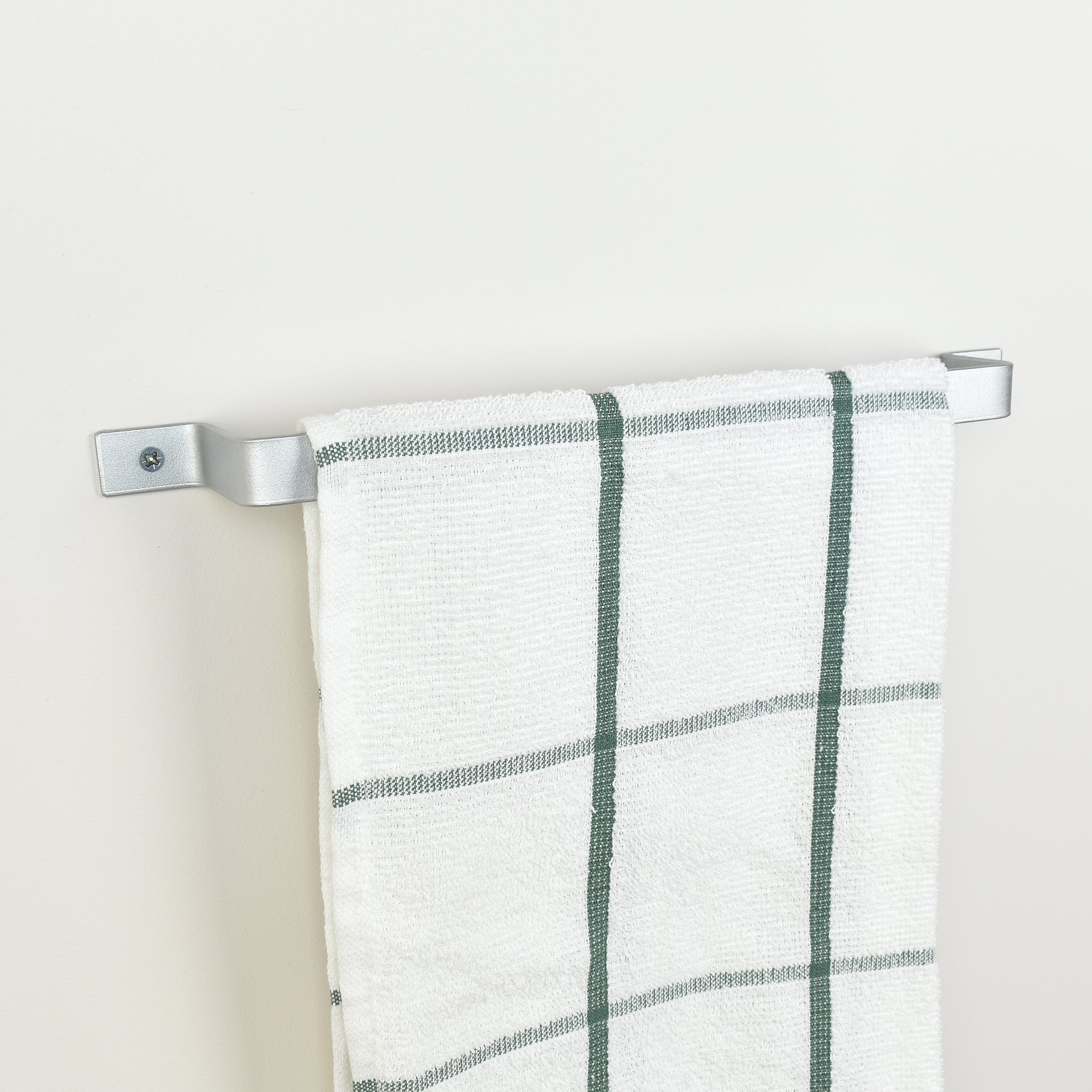 Silver industrial towel rail end bracket detail - handcrafted metal bathroom hardware made in UK