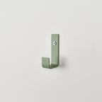 Colourful steel wall hook close-up right view - coat hook detail kids nursery