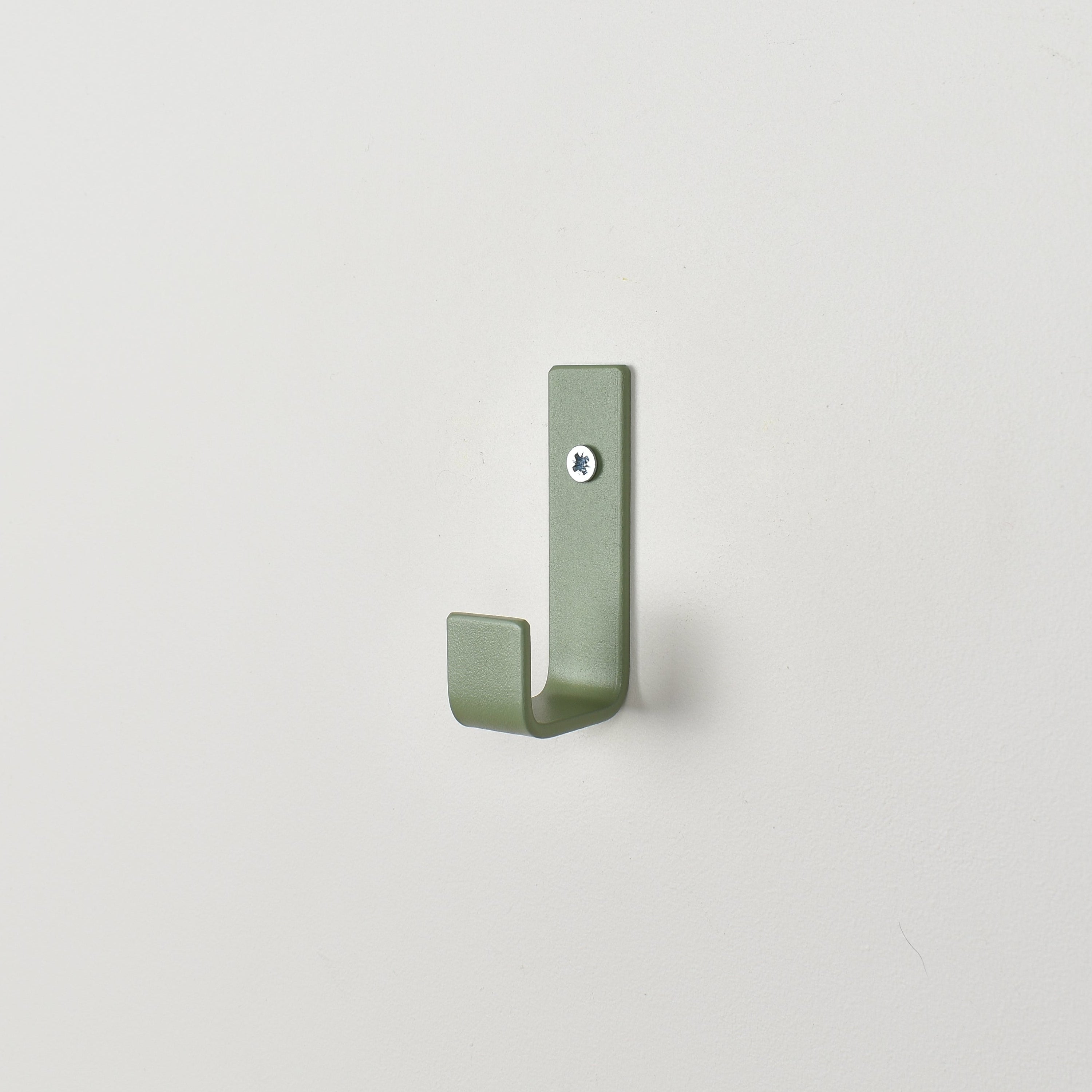 Colourful steel wall hook close-up right view - coat hook detail kids nursery