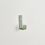 Colourful steel wall hook close-up left view - coat hook detail kids nursery