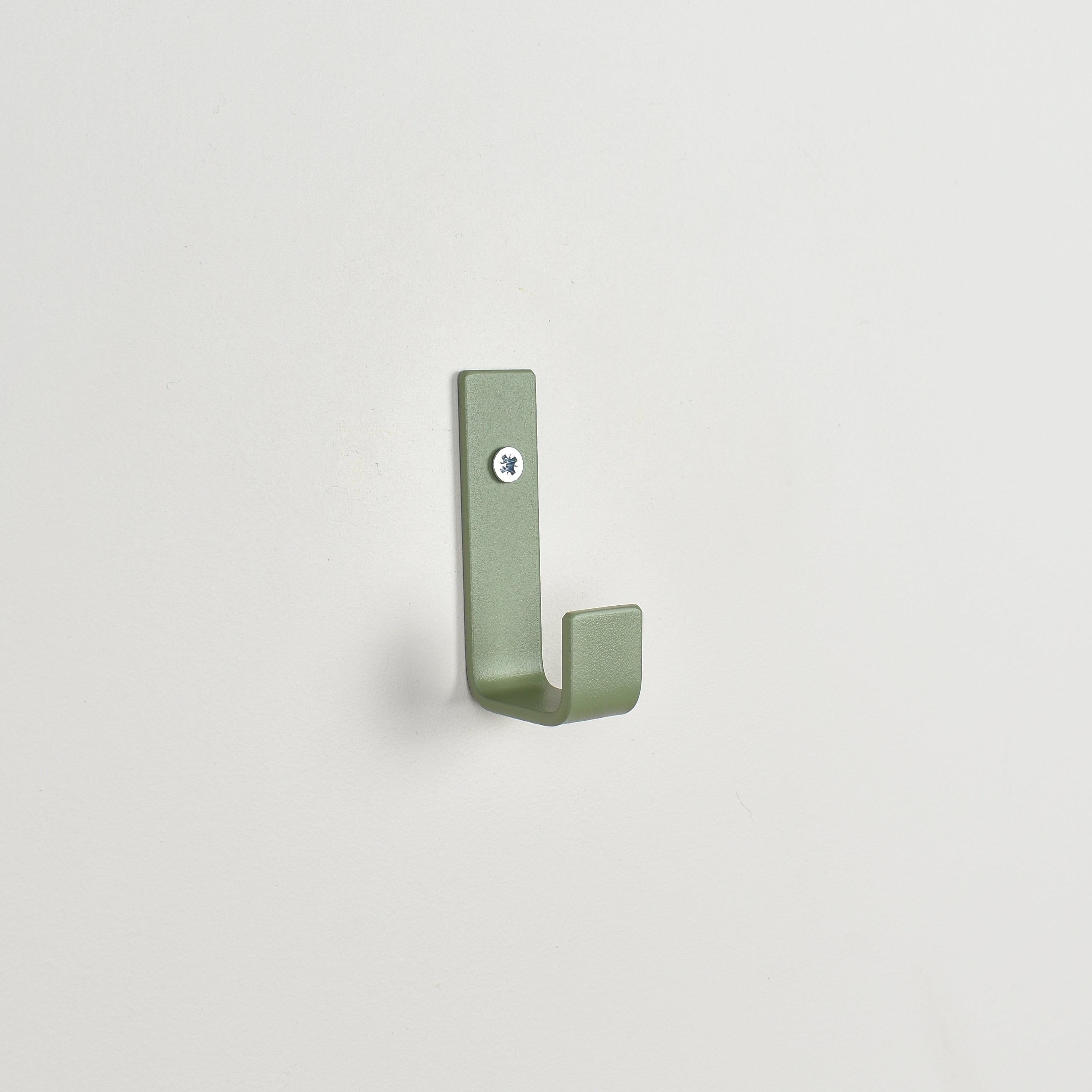 Colourful steel wall hook close-up left view - coat hook detail kids nursery