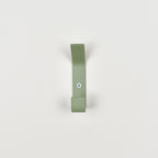 Double colourful wall hook close-up front view - steel coat hook detail kids nursery