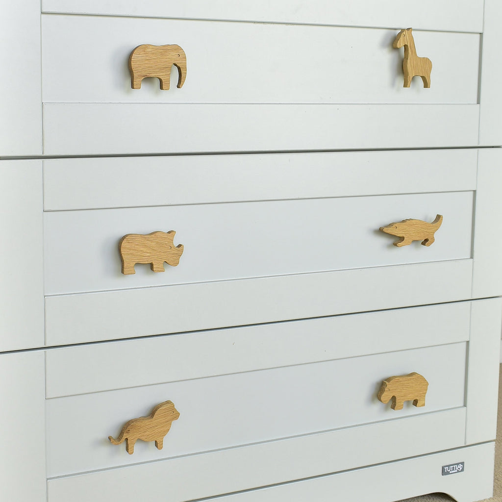 Safari animal drawer knobs close-up left angle - Elephant Giraffe Rhino Crocodile Lion Hippo oak