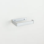 Metallic silver steel toilet roll holder showing fixing  left angle bathroom hardware
