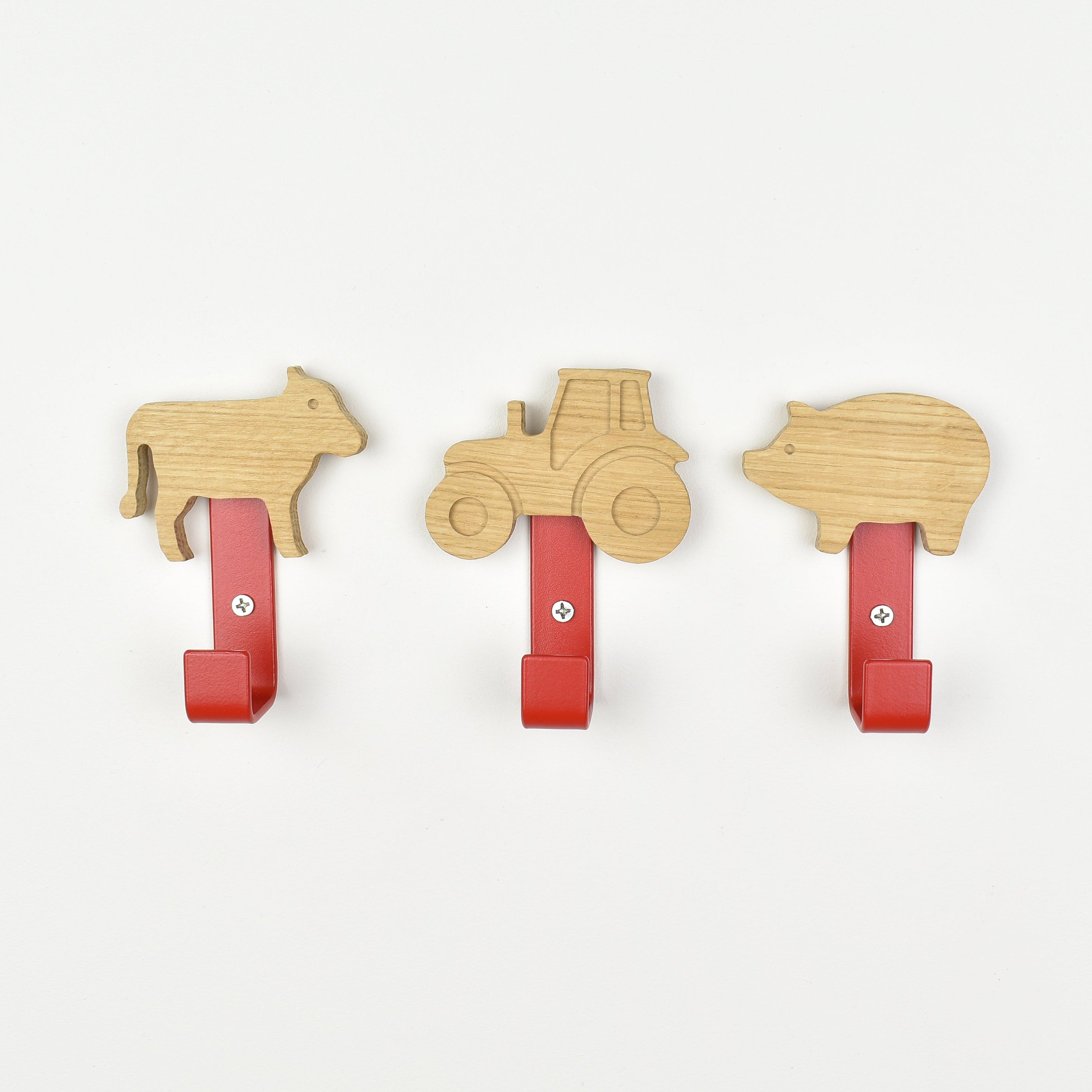 Farmyard theme wall hooks front view - cow tractor pig wooden hooks for children's room