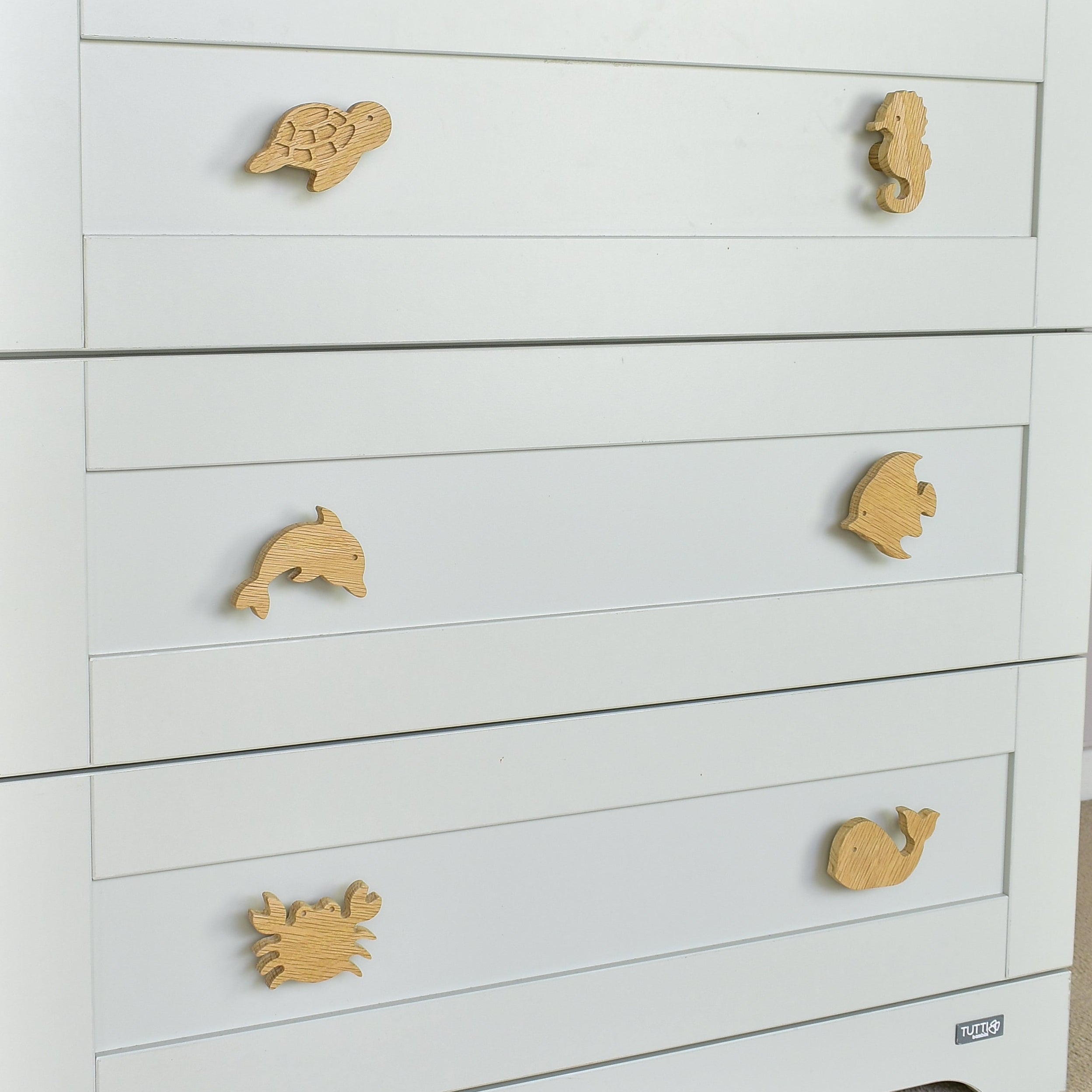 Ocean drawer knobs close-up left angle - Turtle Seahorse Dolphin Angelfish Crab Whale oak