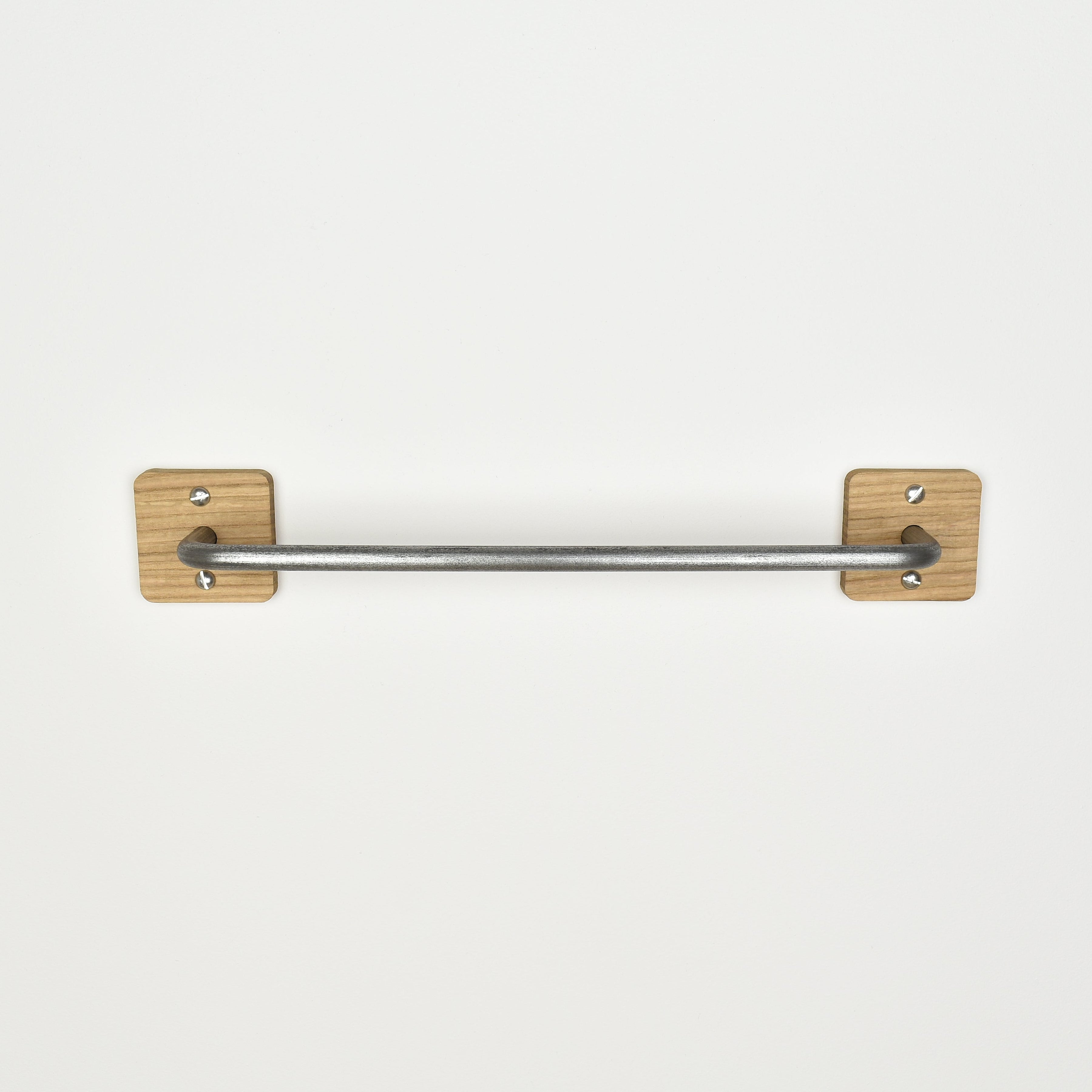 Pewter steel bar with oak fixing plates - front view showing fixings