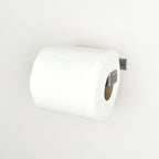 Pewter metal toilet paper holder right view showing toilet paper roll 