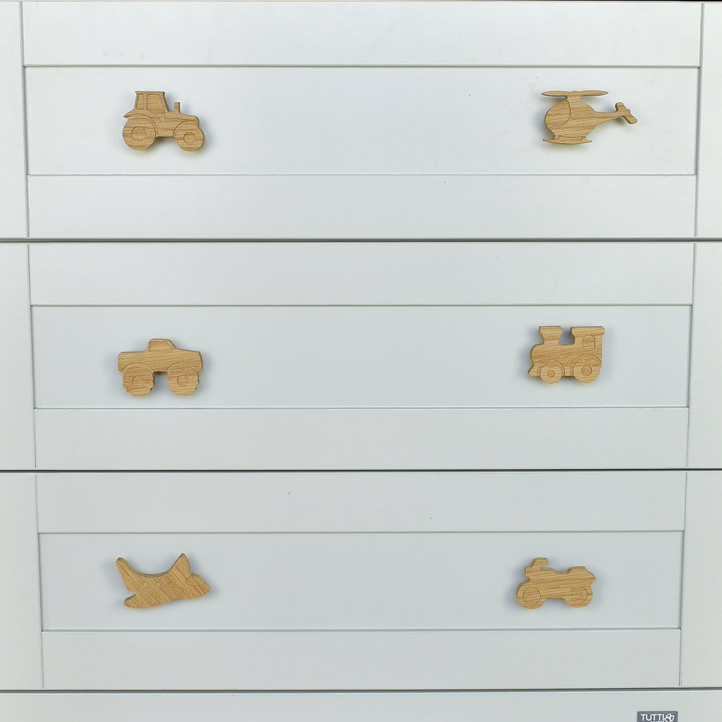 Transport oak drawer handles close-up front view - tractor helicopter monster truck train aeroplane motorbike handcrafted detail