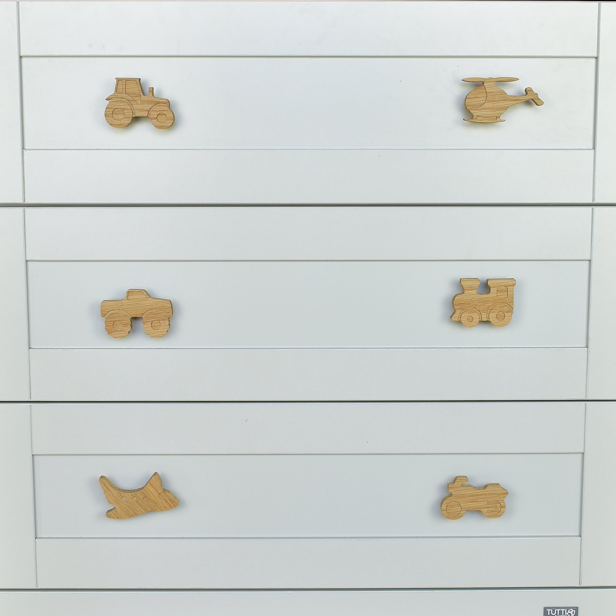 Transport oak drawer handles close-up front view - tractor helicopter monster truck train aeroplane motorbike handcrafted detail
