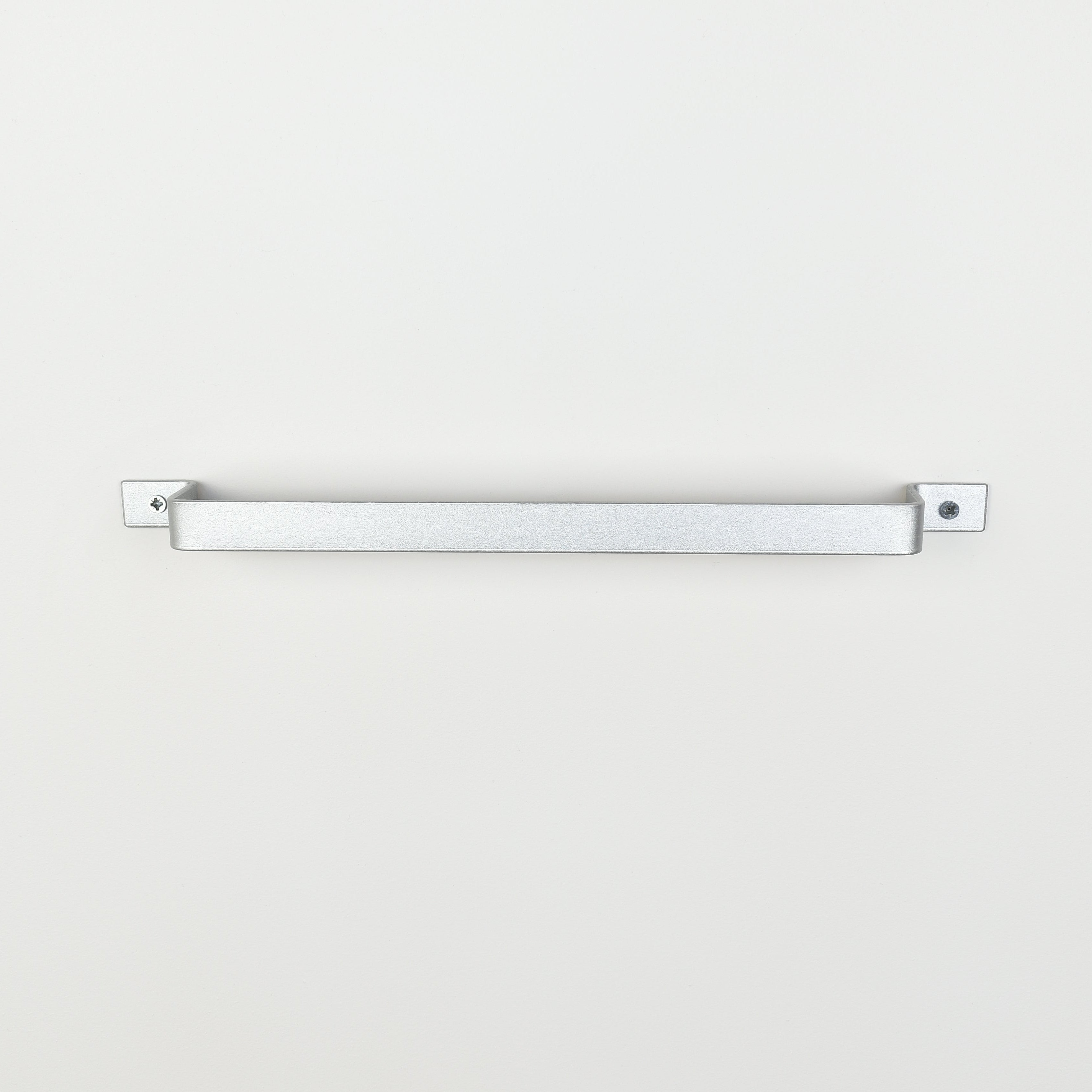 Front facing metallic silver steel towel bar on white wall - contemporary bathroom accessory