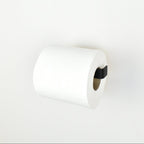 roll of toilet paper on a matte black steel toilet roll holder - right view