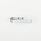 rounded edge silver metal toilet roll holder with a white background - front view