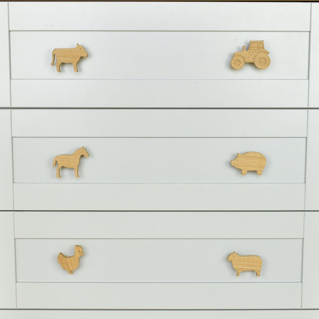Farmyard oak drawer handles close-up front view - tractor cow horse pig chicken sheep kids nursery decor 