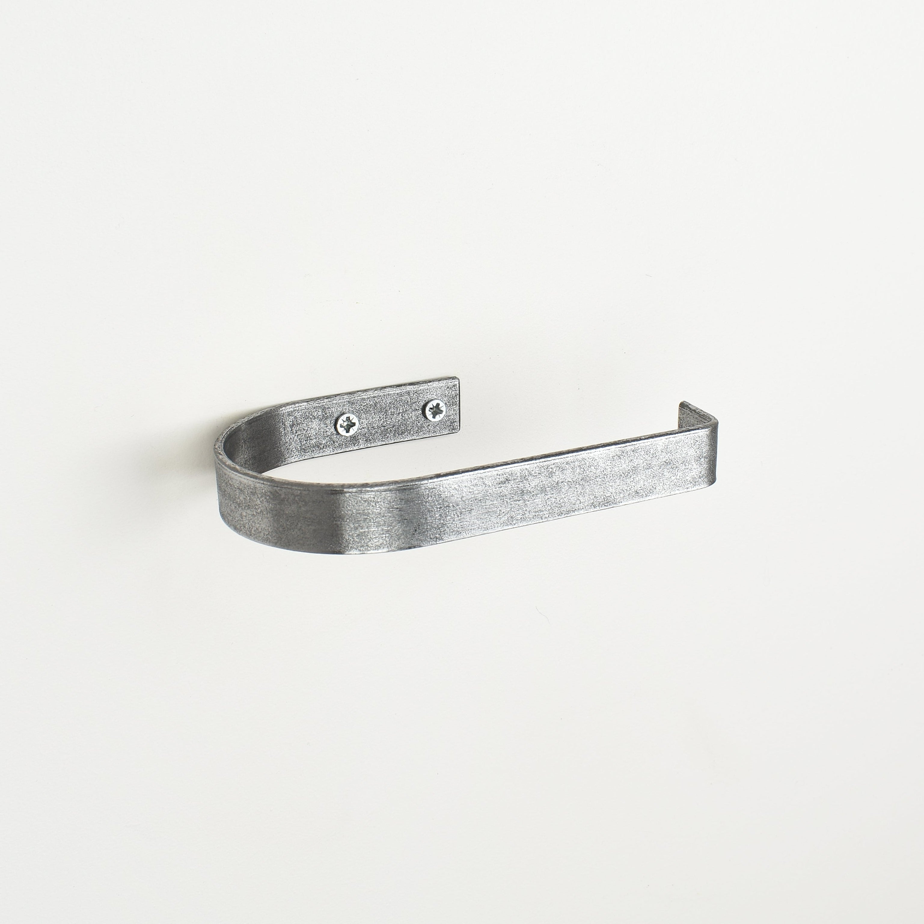 rounded edge pewter metal toilet roll holder with a white background - left view