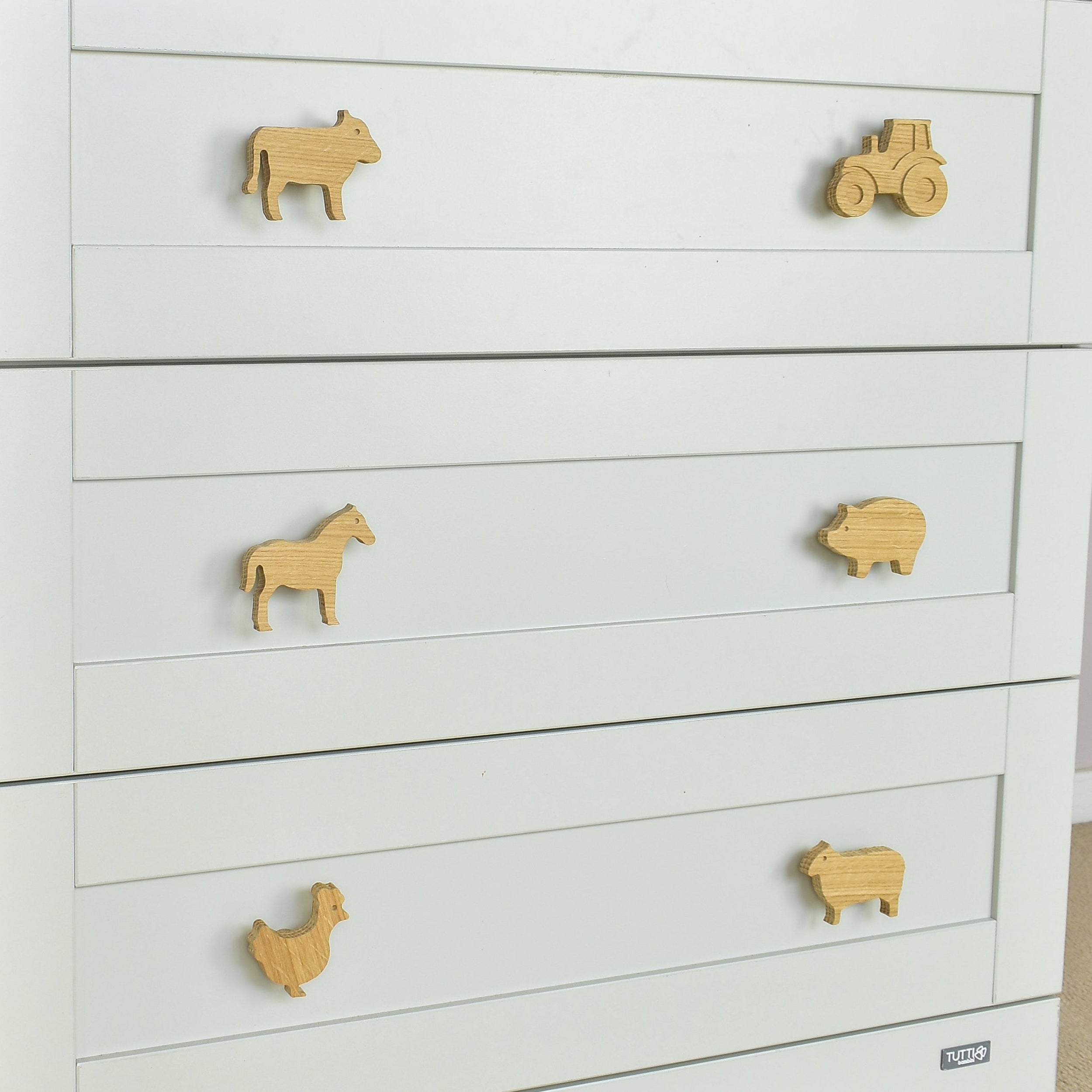 Farmyard oak drawer handles close-up left view - tractor cow horse pig chicken sheep kids nursery decor 