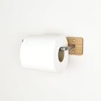 oak toilet paper holder with a roll of toilet paper on a white background