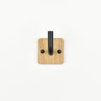 solid oak wall hook with black metal bar - front view