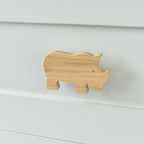 Oak rhino drawer knob fitted to a white chest of drawers showing natural wood grain