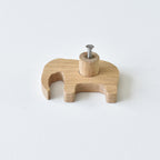 Back of oak elephant drawer knob showing threaded insert and fixing screw