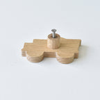 Back of oak construction vehicle drawer knob showing threaded insert and fixing screw