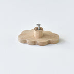 Back of oak cloud drawer knob showing threaded insert and fixing screw