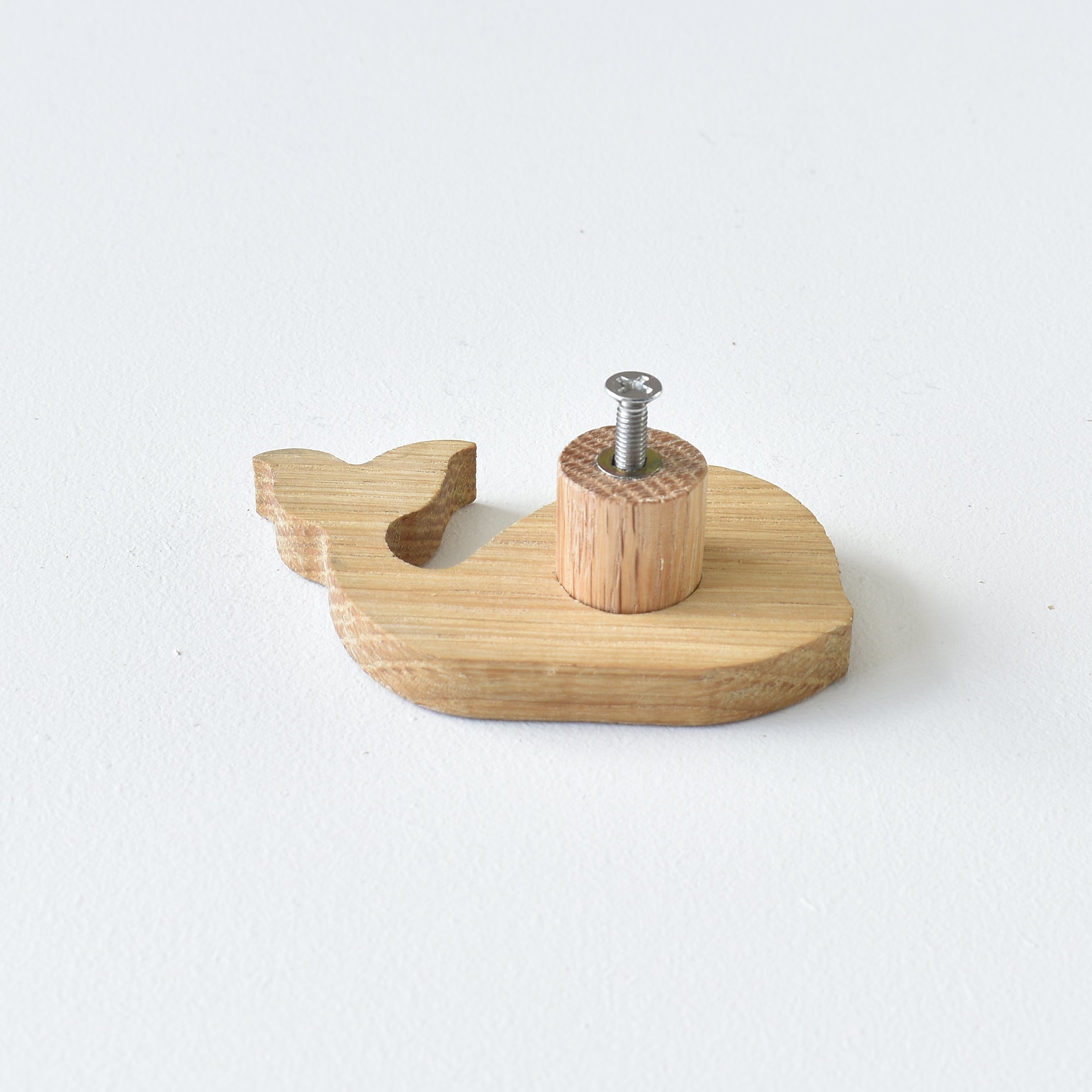 Back of oak whale drawer knob showing threaded insert and fixing screw