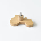 Back of oak tractor drawer knob showing threaded insert and fixing screw
