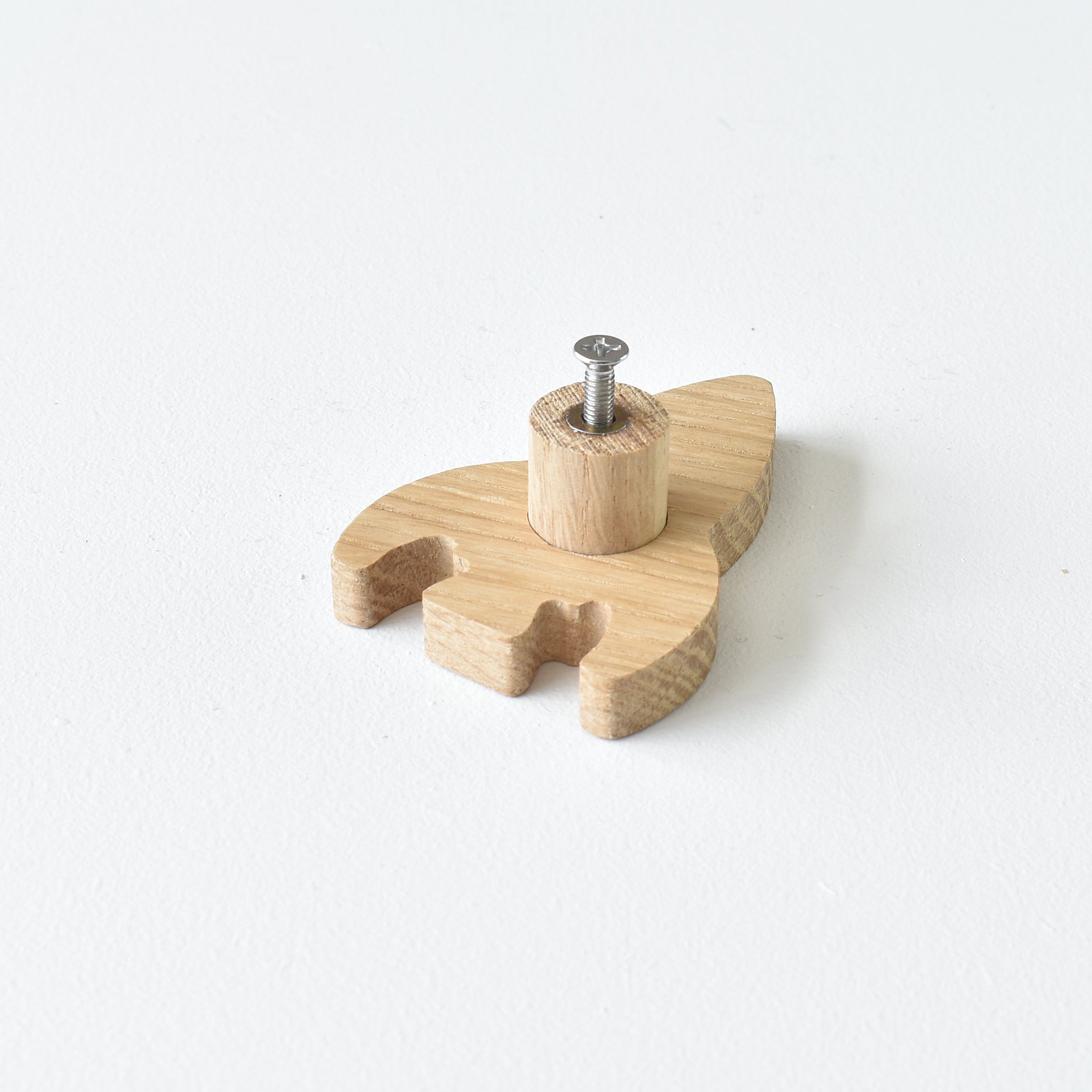 Back of oak rocket drawer knob showing threaded insert and fixing screw