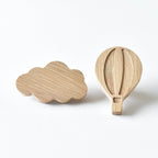 Oak hot air balloon and cloud drawer knobs showing natural wood grain and raised detail