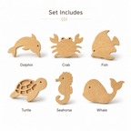 Set of six handmade oak ocean animal drawer knobs including dolphin, crab, fish, turtle, seahorse and whale