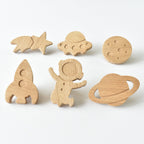 Set of six handmade oak space themed drawer knobs including rocket, astronaut, UFO, planet, moon and shooting star designs