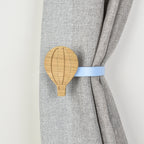 Curtain tieback with wooden hot air balloon design