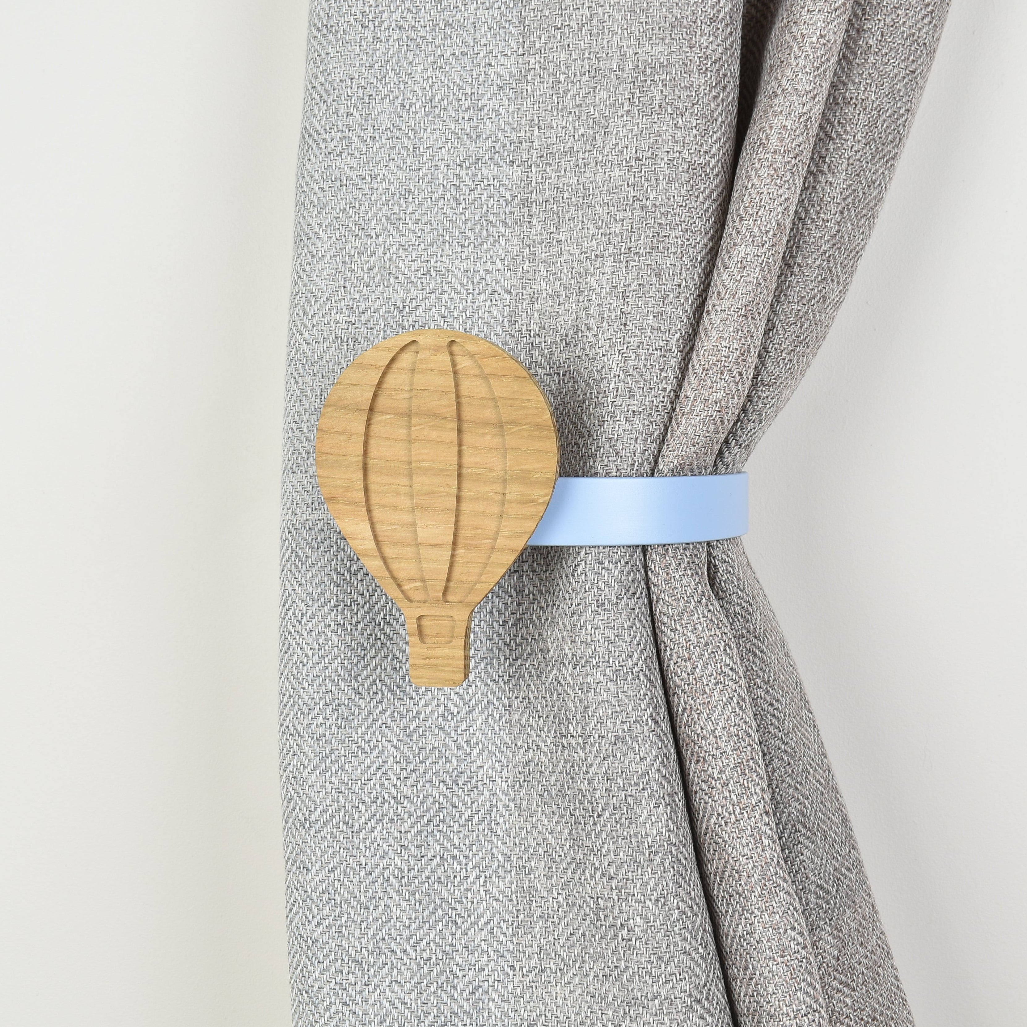 Curtain tieback with wooden hot air balloon design