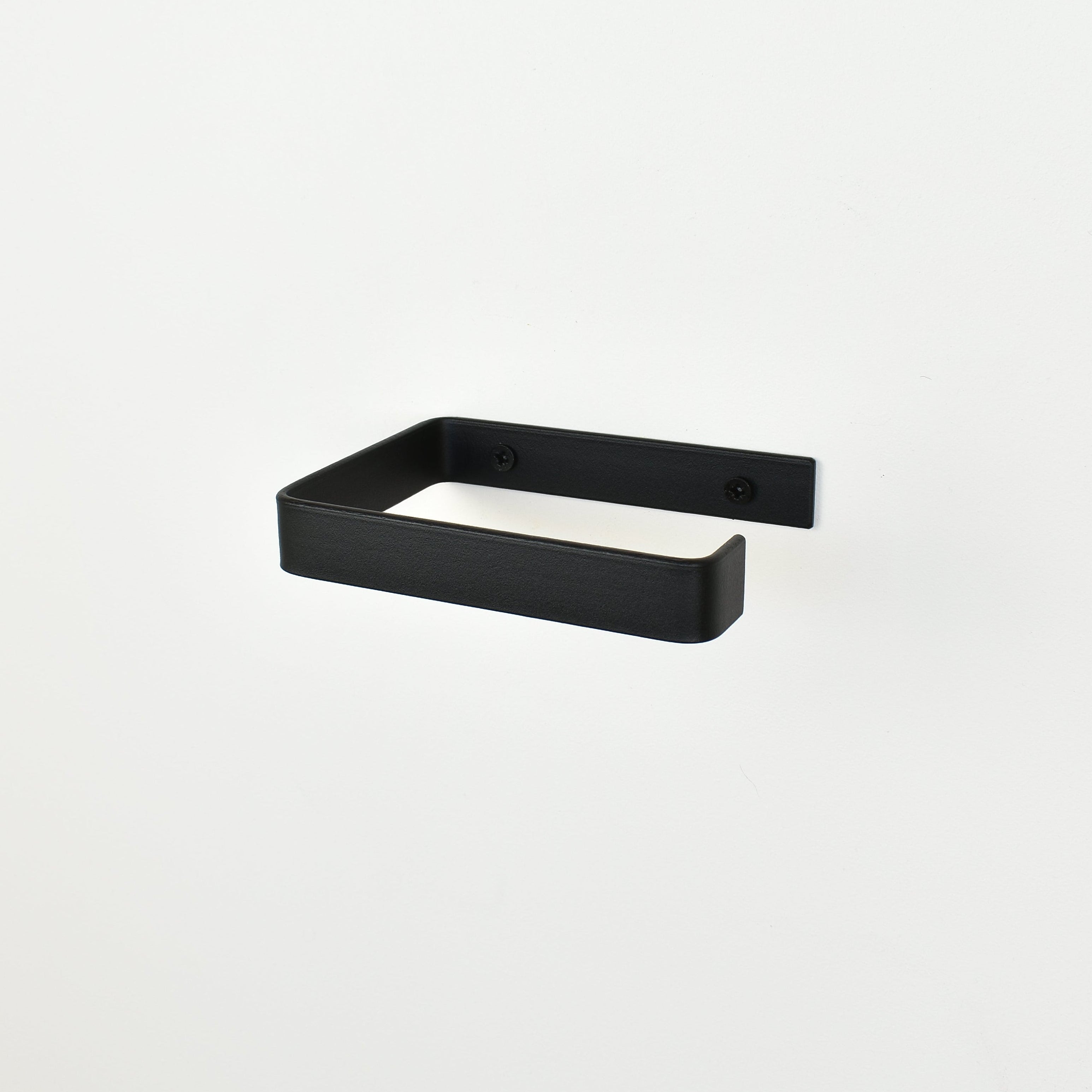 black metal toilet roll holder with a white background
