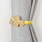 Wooden construction truck shaped curtain tieback